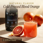 Glass of TotalRestore Magnesium with cold-pressed blood orange flavour, sugar-free, ready to drink